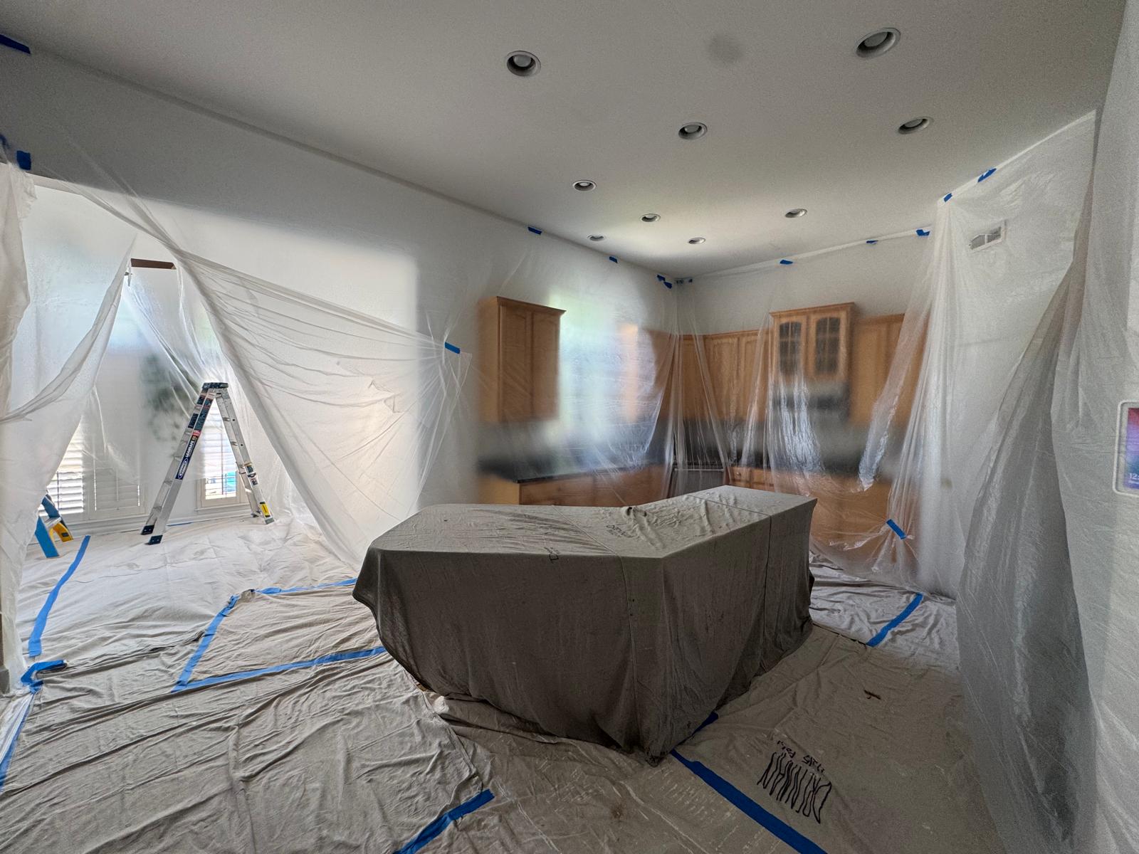 Kitchen fully masked and protected before painting