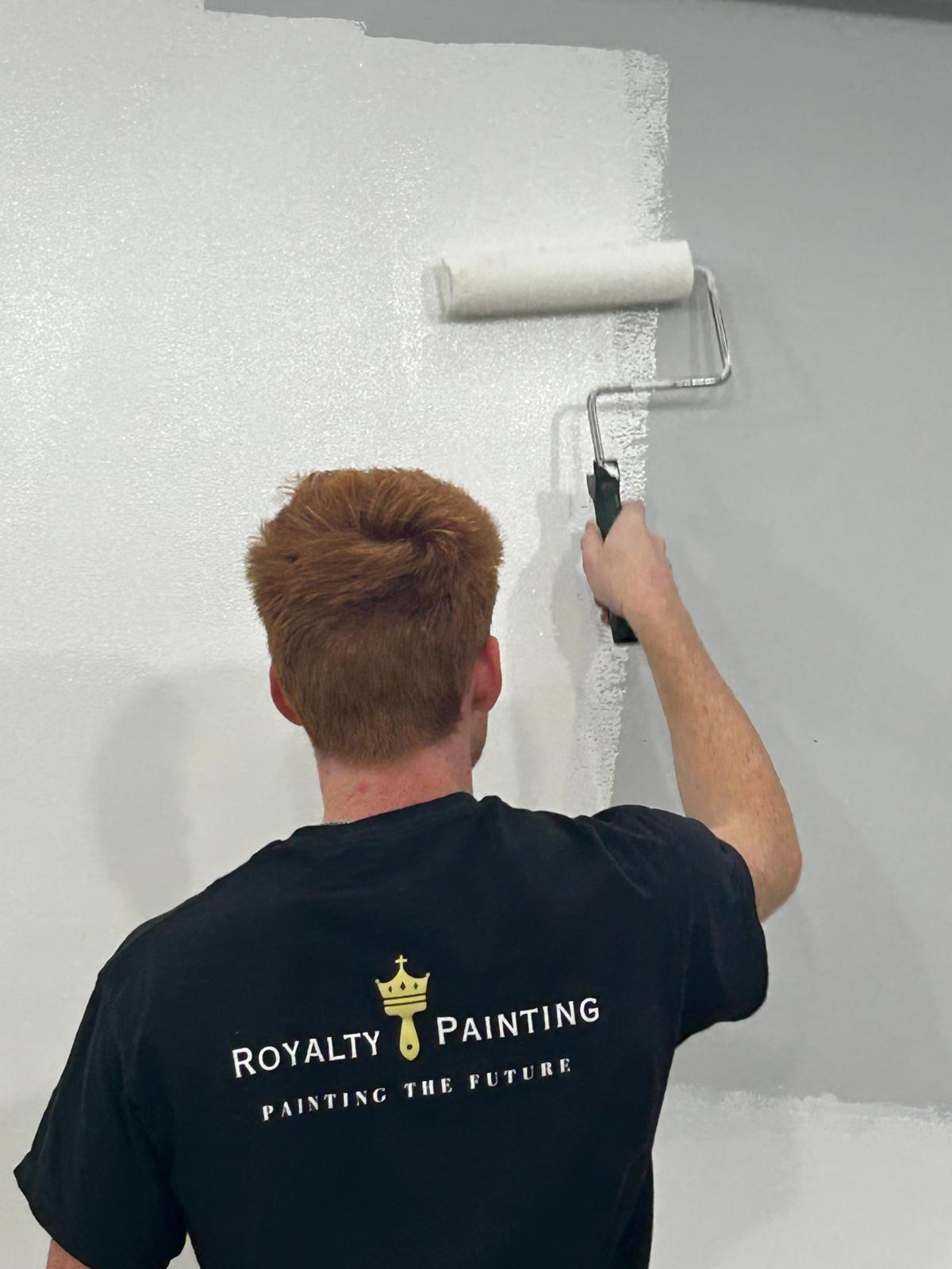 Royalty Painting crew rolling a wall