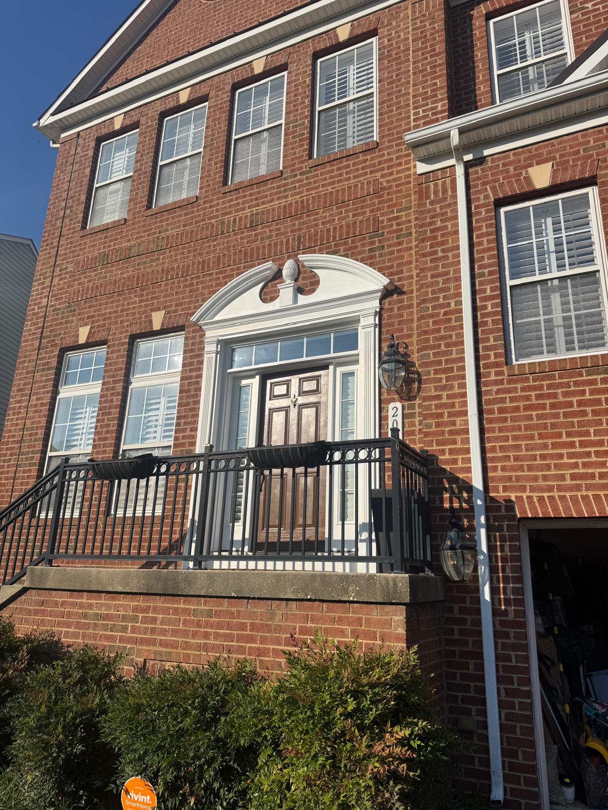 Brick home exterior with painted trim